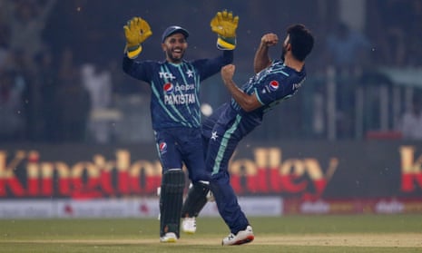 Pakistan’s Aamer Jamal (right) and Mohammad Haris celebrate after winning the match.