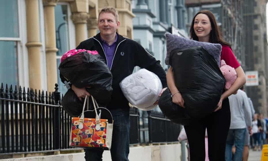 A father helps his daughter move in to her first-year hall of residence at Aberystwyth University