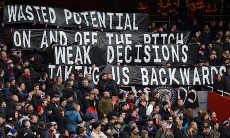 Crystal Palace fans hold a banner on the stands during the match between Arsenal and Crystal Palace at the Emirates Stadium