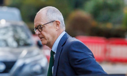 Head ands shoulders shot of Patrick Vallance as he gets out of a car