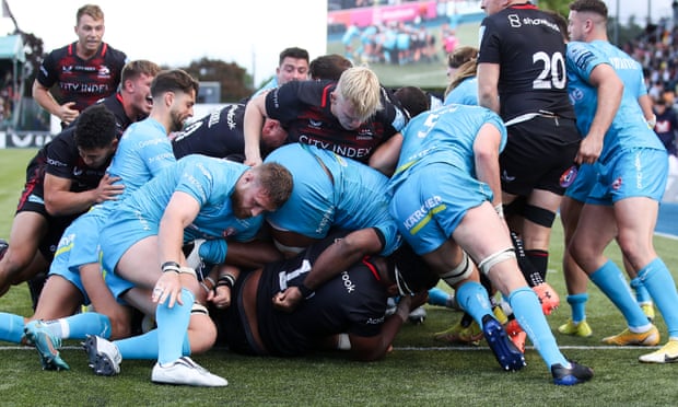 Tom Woolstencroft scores his second try to set up Owen Farrell’s decisive conversion.