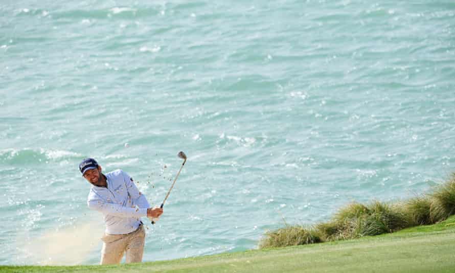The water behind Scott Jamieson shows the strength of the wind at Yas Links on day two.