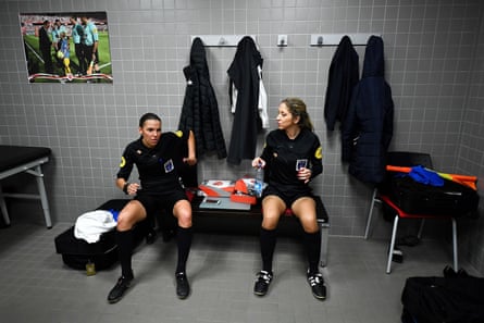 French referee Stephanie Frappart speaks with her assistant Manuela Nicolosi before the French Ligue 2 match between Valenciennes and Beziers.