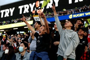 New Zealand supporters celebrate a try during the New Zealand 2021 Womens Rugby World Cup final match between New Zealand and England.