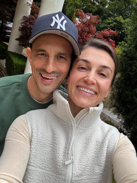 A man and woman couple take a happy selfie together