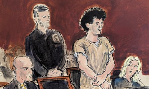 Bankman-Fried, second from right, stands while making a statement during his sentencing.
