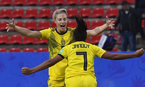 Sweden’s Madelen Janogy (R) celebrates with Nilla Fischer after scoring her team’s second goal.