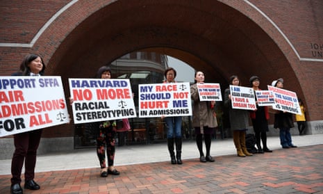 Demonstrators hold slogans in front of a courthouse in Boston, Massachusetts, on 15 October.