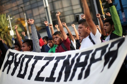 Students participate in a march in Mexico City to mark the 65th month since the disappearance of the 43 missing Ayotzinapa students in the state of Guerrero, 26 February 2020.