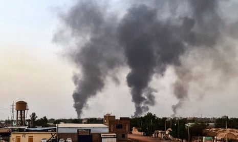 Smoke rises above buildings in Khartoum, Sudan