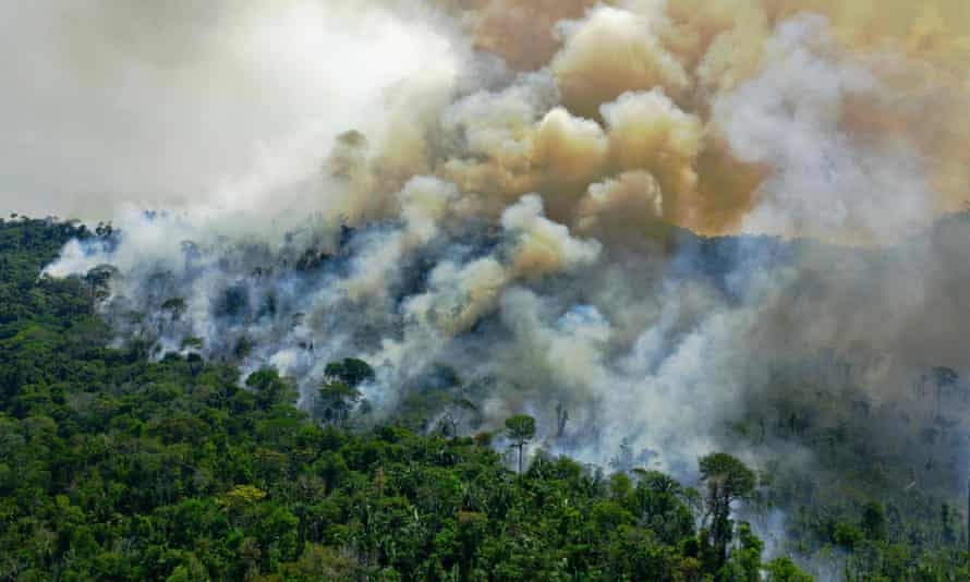 Aerial view of a burning area of Amazon rainforest reserve