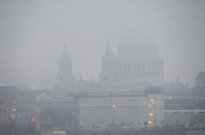 The dome of St Paul’s Cathedral in London is barely visible