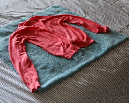 Sweater, which was hand-washed, laying flat to dry on a towel.
