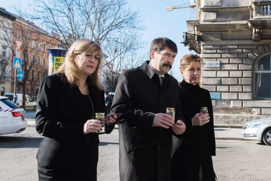 House of Terror Museum director Maria Schmidt, Hungarian president János Áder and his wife, Anita Herczegh, mark Memorial Day for the Victims of Communism in February outside the museum in Budapest.