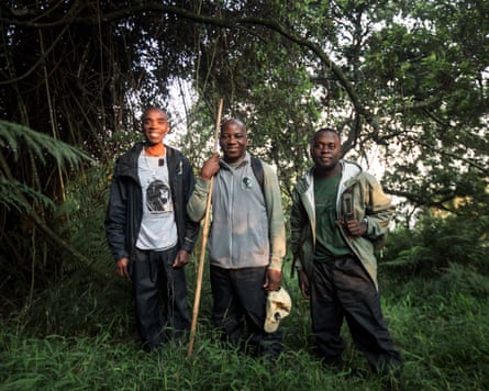 A team from Gorilla Doctors, led by Dr Benard Ssebide, (centre) during their morning gorilla tracking and monitoring routine in the Virunga Mountain.