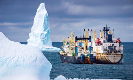 Krill fishing boats amid icebergs in Antarctica