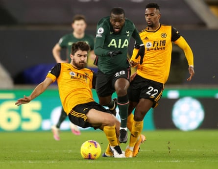 Tottenham Hotspur’s Tanguy Ndombele in action with Wolverhampton Wanderers’ Ruben Neves and Nelson Semedo.
