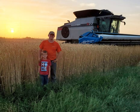 Daniel Kelly and his son in front of Kansas farm