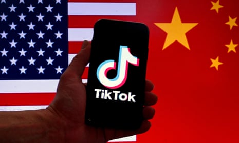 TikTok logo in front of US flag and Chinese flag