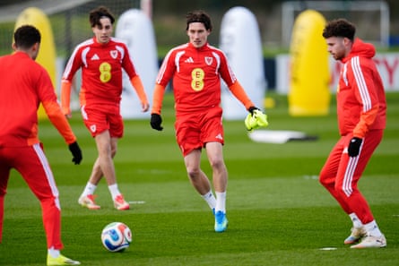Harry Wilson (centre) goes after the ball in training as Wales prepare for their playoff semi-final against Bosnia and Herzegovina