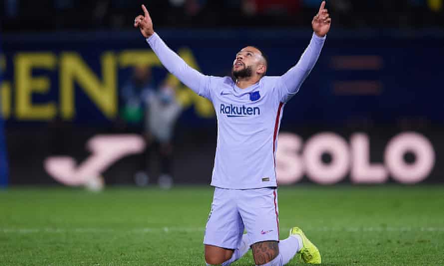 Memphis Depay celebrates at the final whistle after his goal helped Barcelona win 3-1 at Villarreal.