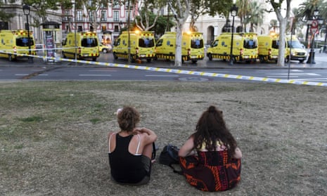 Van Hits Crowds In Barcelona’s Las RamblasBARCELONA, SPAIN - AUGUST 17: People look toward the scene of a terrorist attack in the Las Ramblas area on August 17, 2017 in Barcelona, Spain. Officials say 13 people are confirmed dead and at least 50 injured after a van plowed into people in the Las Ramblas area of the city. (Photo by David Ramos/Getty Images)