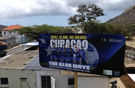A poster of Curacao’s national football team hangs at the entrance of Marchena, a working-class neighborhood of Willemstad, the capital of the smallest territory ever to qualify for a World Cup
