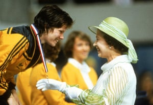 Awarding swimmer Tracey Wickham a gold medal at the Commonwealth Games in Brisbane, 1982.