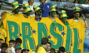 Expecting a win, Brazil supporters wear a massive Brazil t-shirt at the Maracana stadium.
