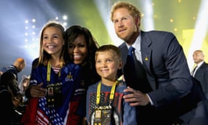 Prince Harry and Michelle Obama meet children of servicemen and women during the Opening Ceremony of the Invictus Games in Orlando, Florida.