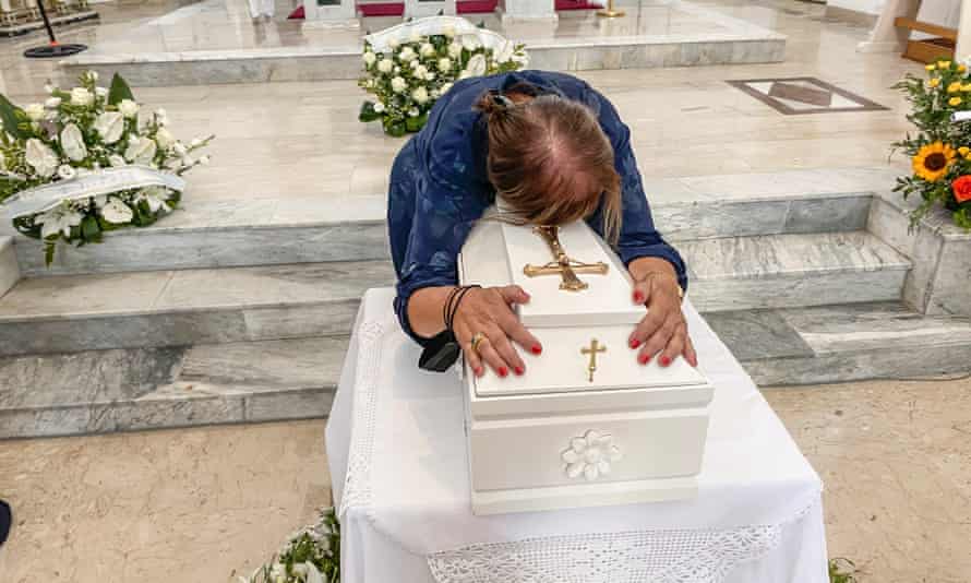 Maria Lucia Mantione embraces Lucia's coffin