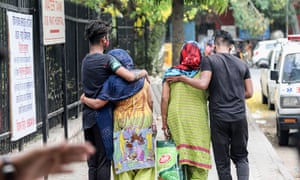 Women mourn the death of a family members due to Covid-19 coronavirus disease outside the Lok Nayak Jai Prakash Narayan Hospital.