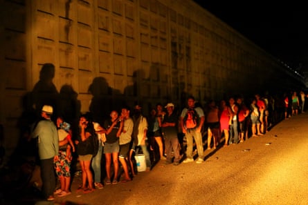 People queue for supplies in Puerto Marquez, near Acapulco, on Wednesday.