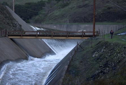 Water flows down the spillway at Nicasio Reservoir after days of rain have brought the reservoir to near capacity on 9 January 2023 in Nicasio, California.