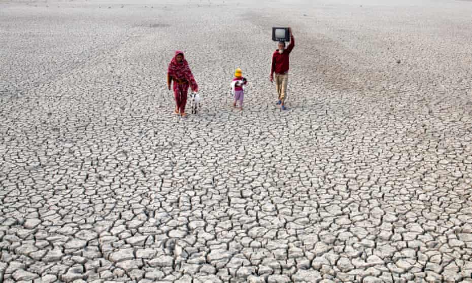 Villagers walking on a dried riverbed in November 2015 in Satkhira, Bangladesh, one of the world's most vulnerable countries to climate change