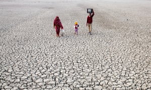  Villagers on a dried riverbed in Bangladesh. The green law firm ClientEarth says clients could bring legal cases if fund managers allow emissions to erode the value of their stock. 
