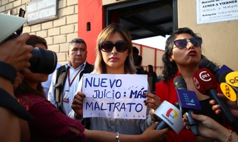 Arlette Contreras holds a sign that reads ‘New trial: more abuse’ after leaving a hearing in Lima in 2018. Contreras is now running for office.