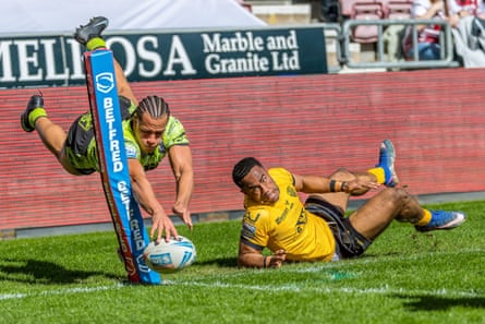 Dayon Sambou scores a try for Wigan against Castleford.