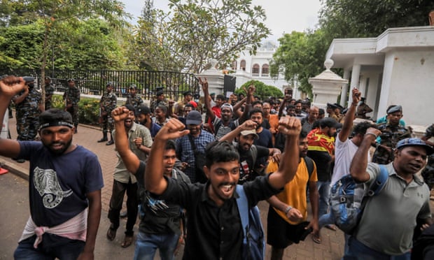 Protesters celebrate outside the prime minister’s office in Colombo after hearing President Gotabaya Rajapaksa had resigned.