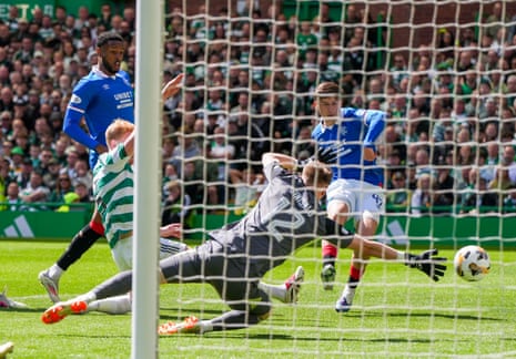 Mikey Moore of Rangers scores past Celtic goalkeeper Viljami Sinisalo to give Rangers a 0-1 lead.
