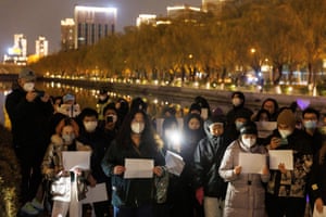 A vigil in Beijing, commemorating victims of the fire in Urumqi.