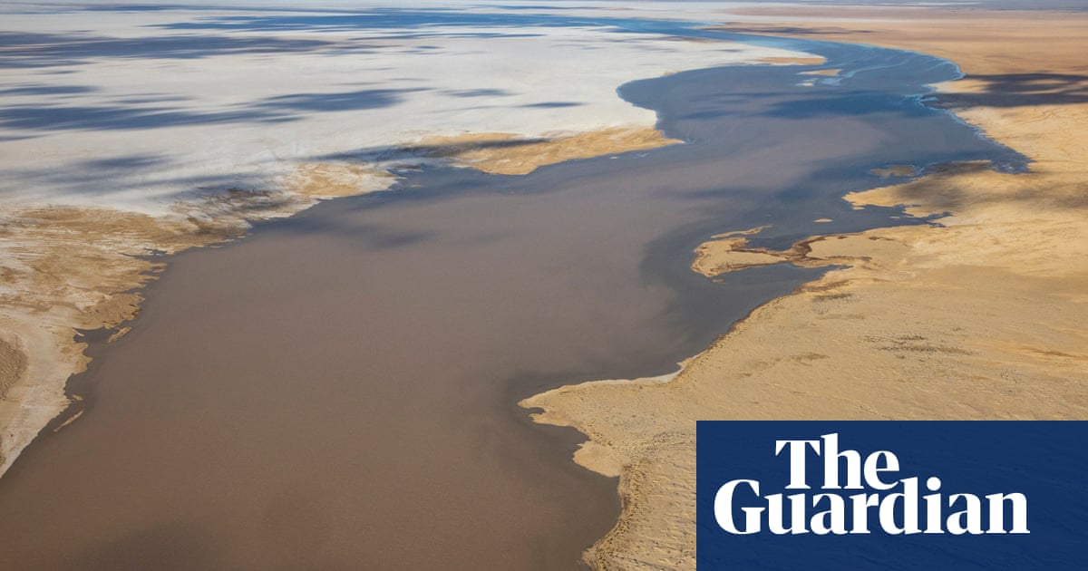Flood waters pour into Kati Thanda-Lake Eyre in rare spectacle supercharged by climate change'