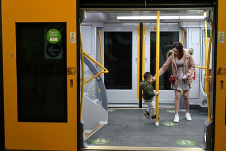 A woman and child riding a Sydney train.