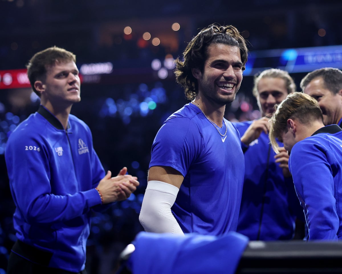 The tennis player Carlos Alcaraz, playing for Team Europe at the Laver Cup, celebrates with his teammates after beating Team World's Taylor Fritz.