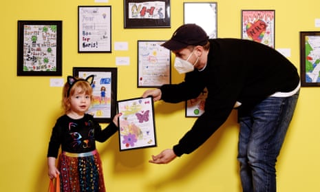 Jonny Banger with one of the young participants at his exhibition The Covid Letters at the Foundling Museum in London.