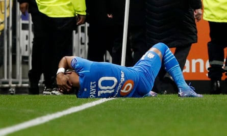 Marseille’s game at Lyon was called off after Dimitri Payet was struck by a water bottle thrown by a fan from the crowd.