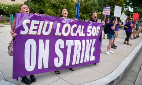 American University staff members participate in a picket line while on strike at the American University Washington College of Law in Washington DC last month.