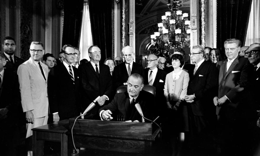 Lyndon Johnson signs the Voting Rights Act of 1965.
