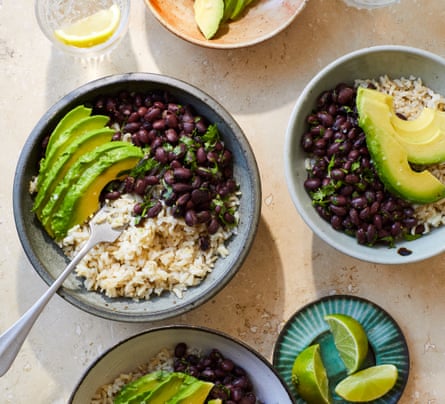 A serving bowl of lime-spiked black bean, avocado and rice.