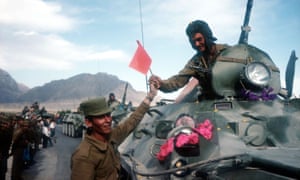 Soviet troops withdraw from Kabul in May 1988.